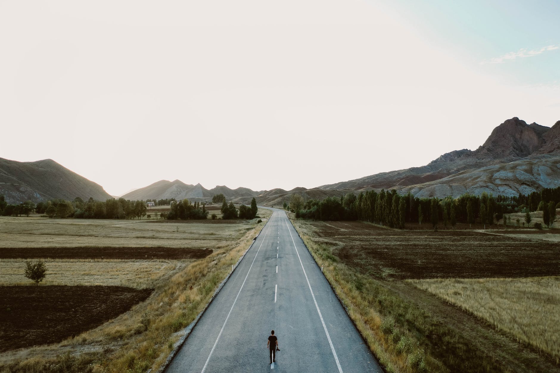 person standing on road